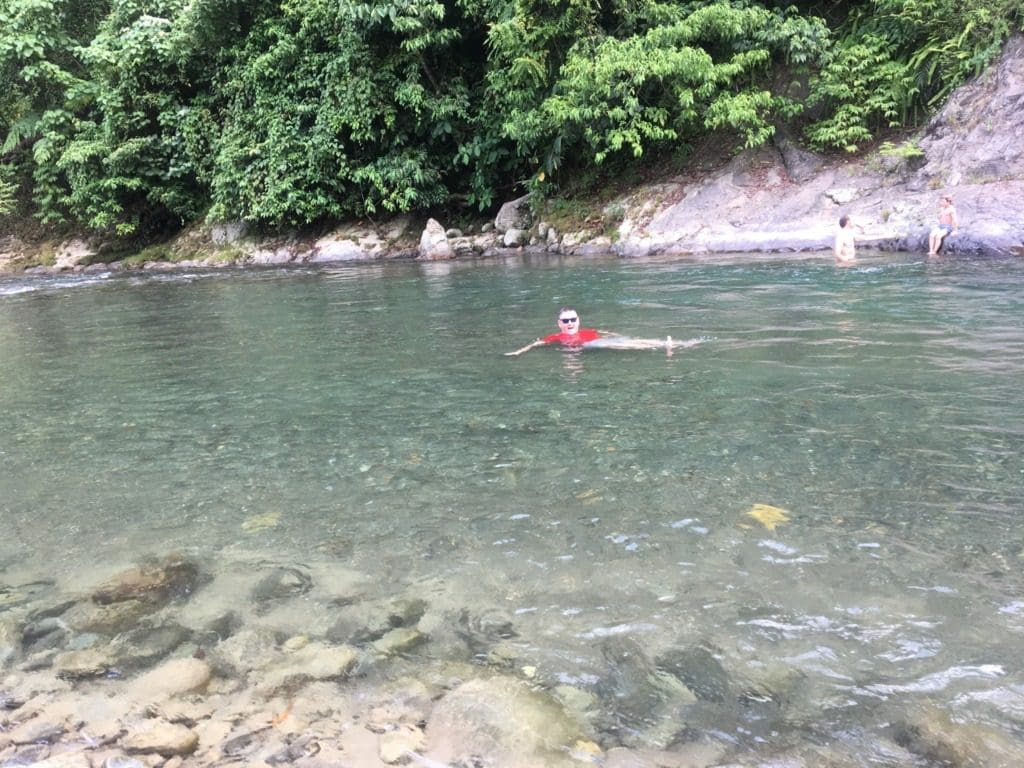 Mike swimming in the river near Jungle Inn, Bukit Lawang