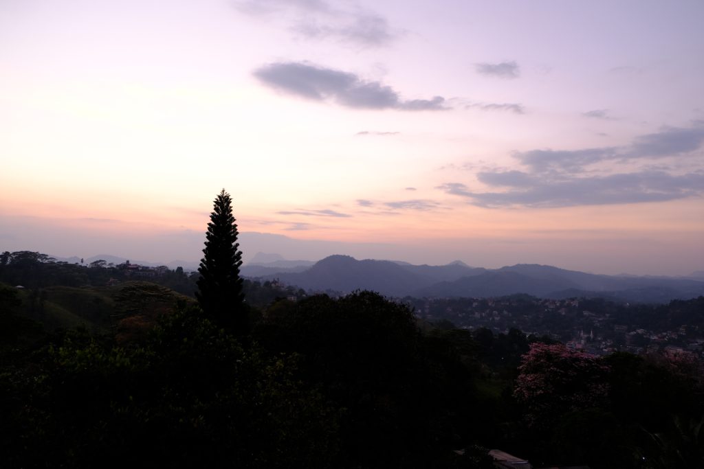 Sunset from our room at Theva Residency Kandy Sri Lanka