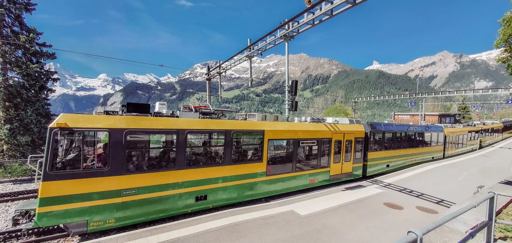 The iconic yellow and green train to Wengen