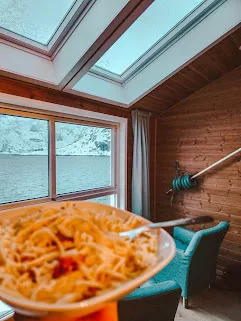  We cooked up some pasta and sat in front of the windows to watch the intermittent snow storms. The sight was magical! The mountains and vast expanse of water with snow blowing across it was enchanting.