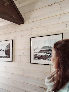 The walls are decorated with old photos of the area