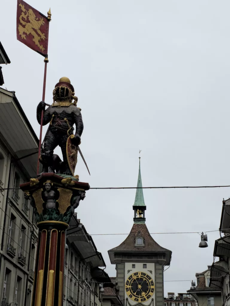 Zähringen Fountain Near the historic Zytglogge (Clock Tower) and at the end of Kramgasse, a bear stands upright on a fountain, overlooking the street. At its feet sits a cub, eating grapes.