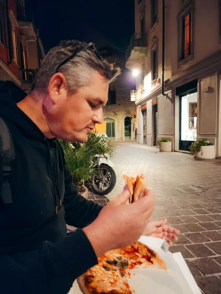 Mike enjoying his pizza from Peach Pit at Como