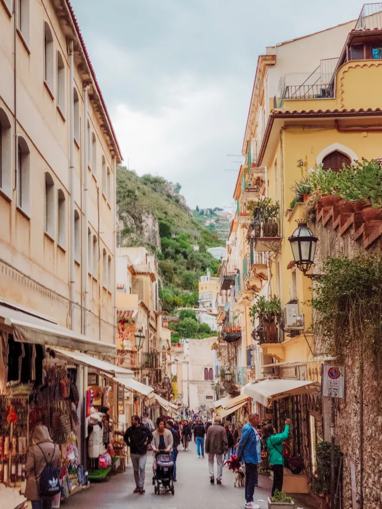 busy street leading to the ancient theatre of Taormina, Sicily