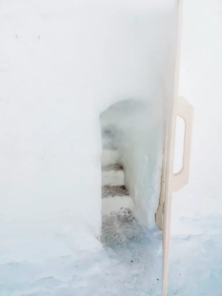 The entrance to the tiny snow saunas at Arctic Snow Hotel Lapland Finland 